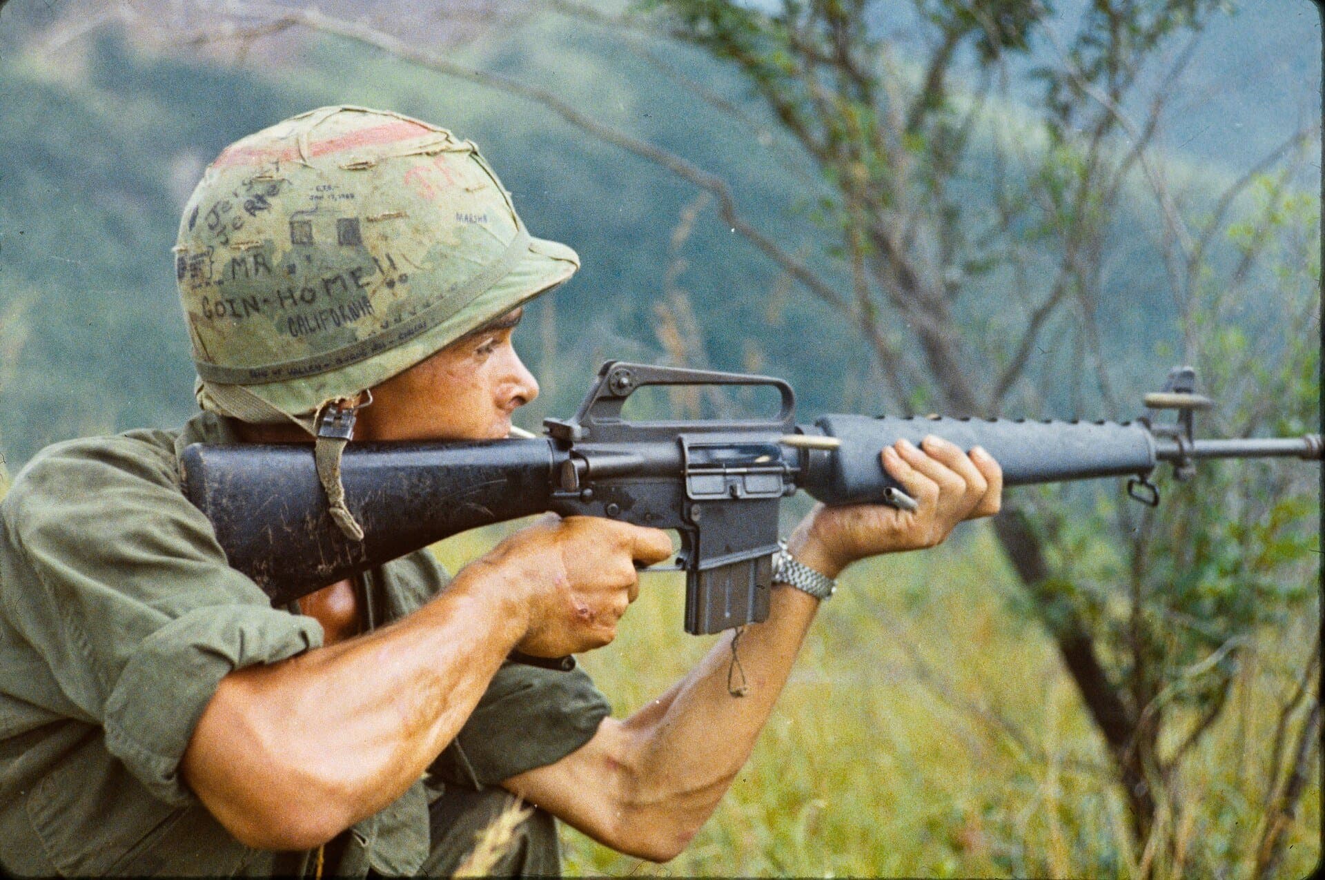 101st Airborne Division soldier firing M16 rifle during Operation Cook in Vietnam, 1967