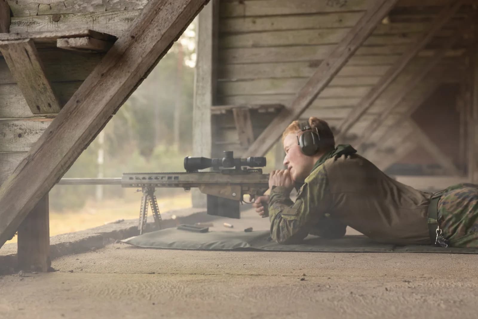 Long-range rifle competitor in prone position during F-class match