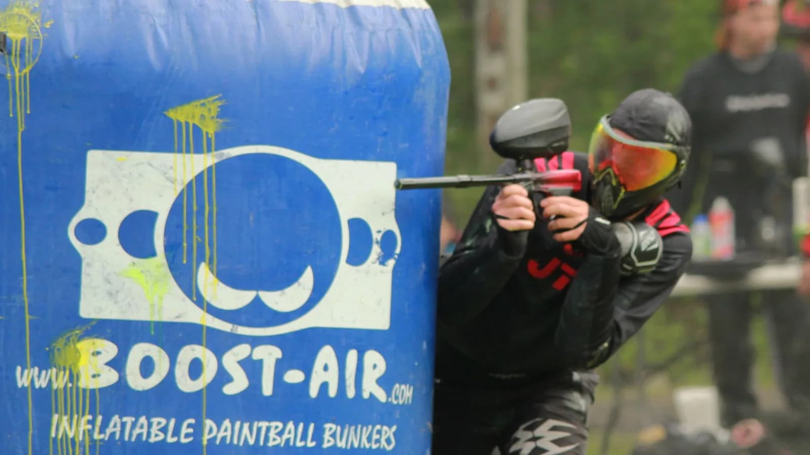 Paintball player in tactical gear during outdoor game